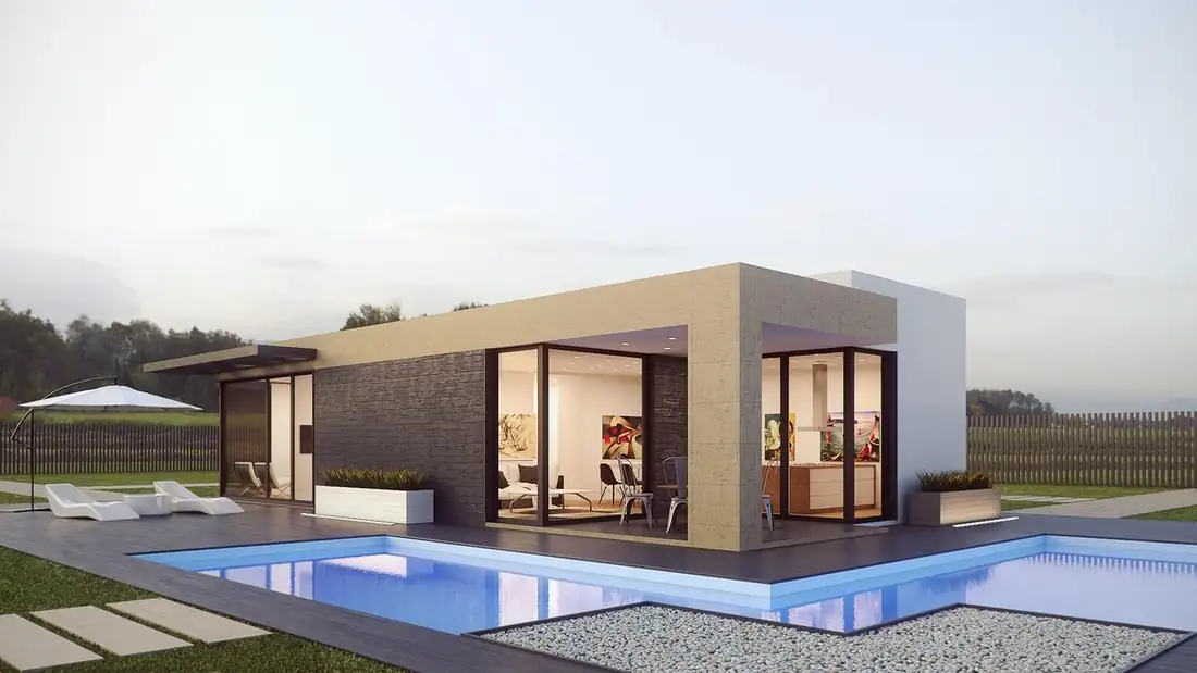 Modules préfabriqués levés par grue sur une parcelle aménagée pour un programme locatif en construction.
